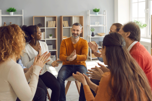 group of people talking in a dual diagnosis treatment program